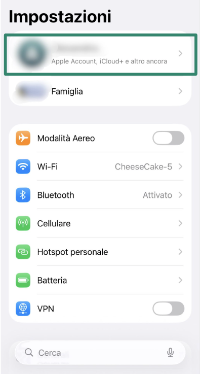 iPhone Settings screen with Apple ID option highlighted.
