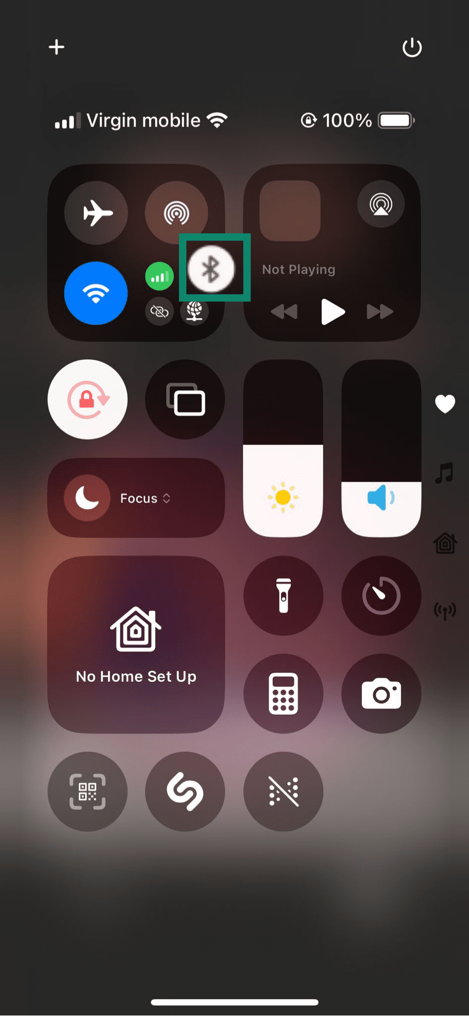 Turning off Bluetooth via Control Center on an iPhone.