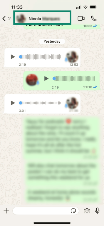 An WhatsApp chat on iOS, with the name of the participant on the other end highlighted.