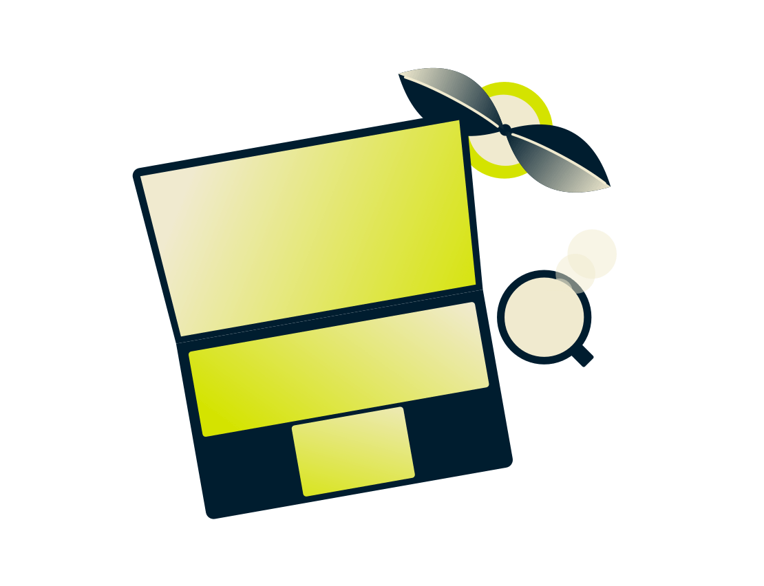 Laptop sa biljkom i pićem.