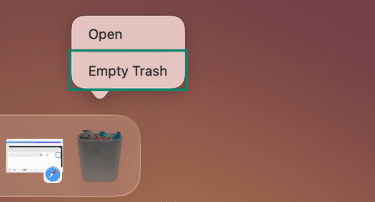 MacOS's dock with the Trash icon in focus and the Empty Trash menu option highlighted.